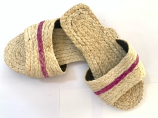 A handcrafted slippers made of pineapple fiber, is an eco- friendly and sustainable footwear option. These slippers boast a natural golden hue and are known for softness and breathability. Pineapple fiber slippers are a unique and comfortable choice for concious consumer.